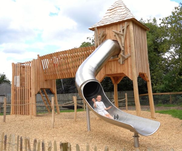 outdoor play area girl on slide